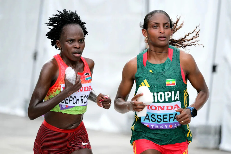 Kenya's athlete Peres Jepchirchir (L) and Ethiopia's athlete Tigst Assefa compete in the women's marathon final during the World Athletics Championships in Tokyo on September 14, 2025. (Photo by Yuichi YAMAZAKI / AFP) (Photo by YUICHI YAMAZAKI/AFP via Getty Images)          