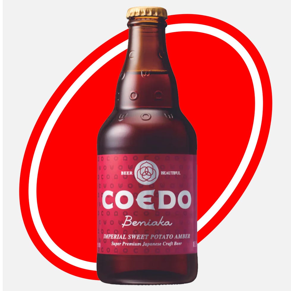 a bottle of coedo beniaka craft beer against a red background