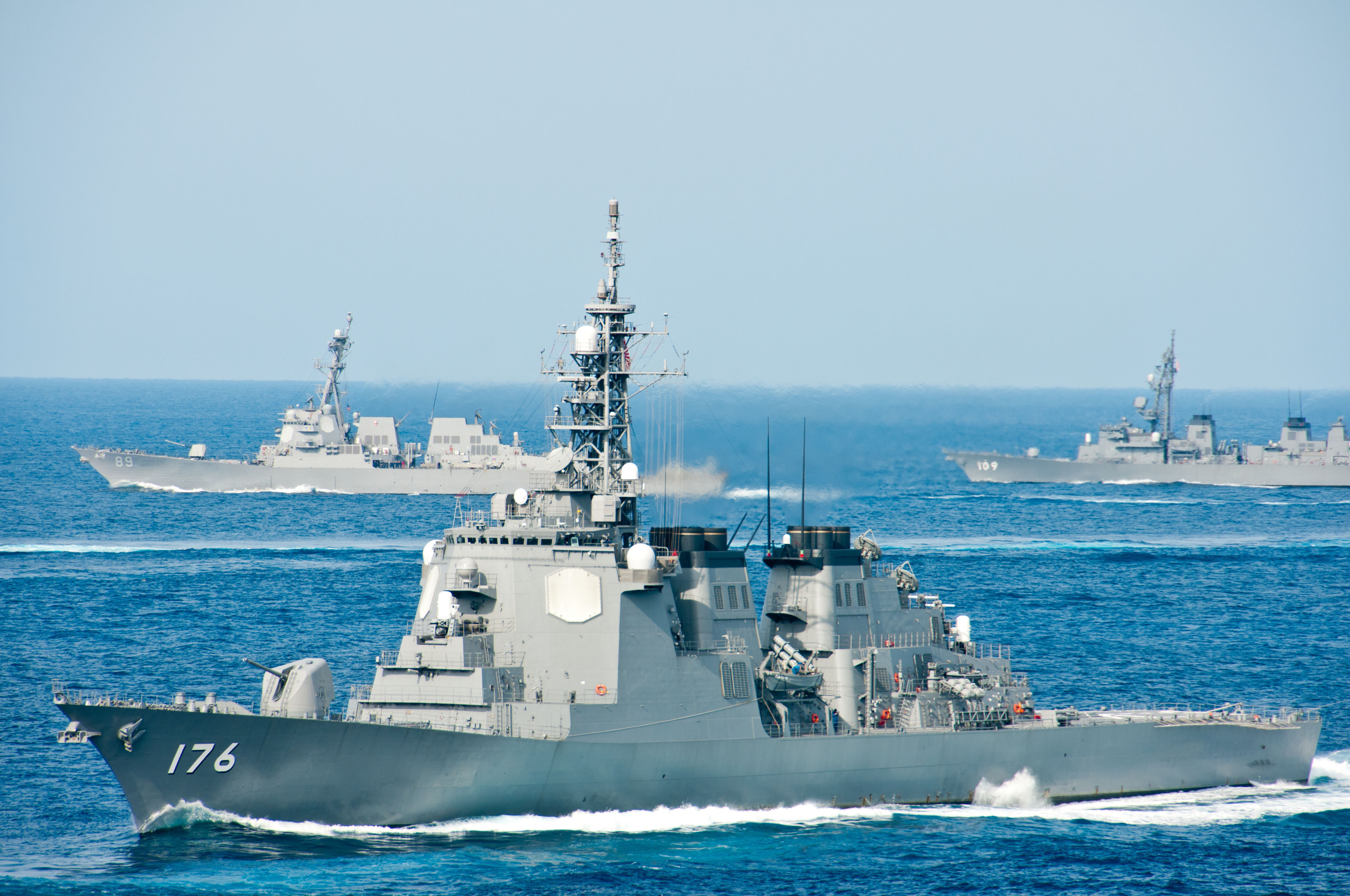 Japan Maritime Self Defense Fleet ship JS Chokai (DDG 176) (front), USS Mustin (DDG 89) (back left) and JS Ariake (DD 109) steam together following the conclusion of Keen Sword 2013. Keen Sword is a regularly scheduled exercise that enables the United States and Japan to practice coordination procedures and improve interoperability required to effectively defend Japan or respond to a crisis in the Asia-Pacific region. (US Navy photo by Lt. Cmdr. Denver Applehans/Released)