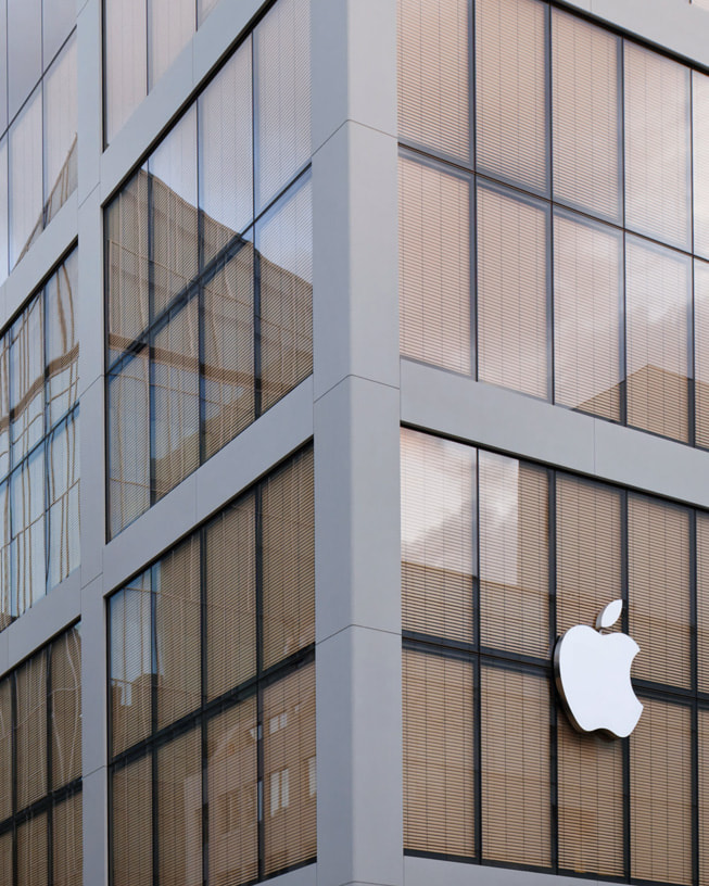 An exterior view of Apple Ginza shows the building's glass façade. 