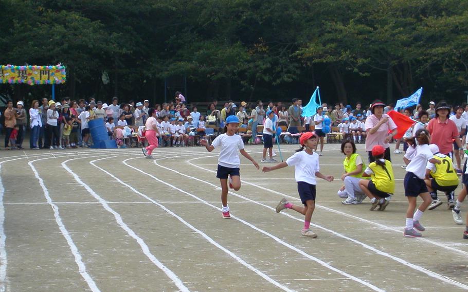 Kids running on the ground.