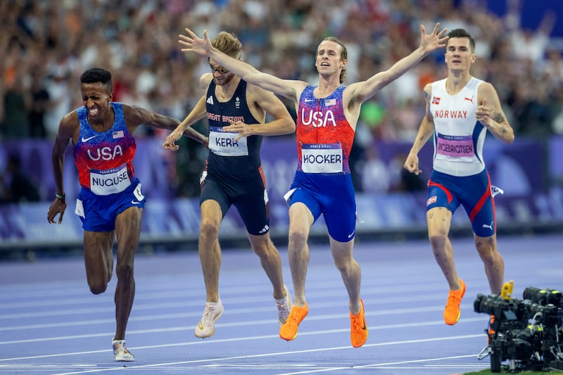 Cole Hocker celebrates winning the men's 1,500m final at the Paris Olympics ahead of Josh Kerr (second), Yared Nuguse (third) and Jakob Ingebrigtsen (right, fourth). Photograph: Tim Clayton/Corbis via Getty Images