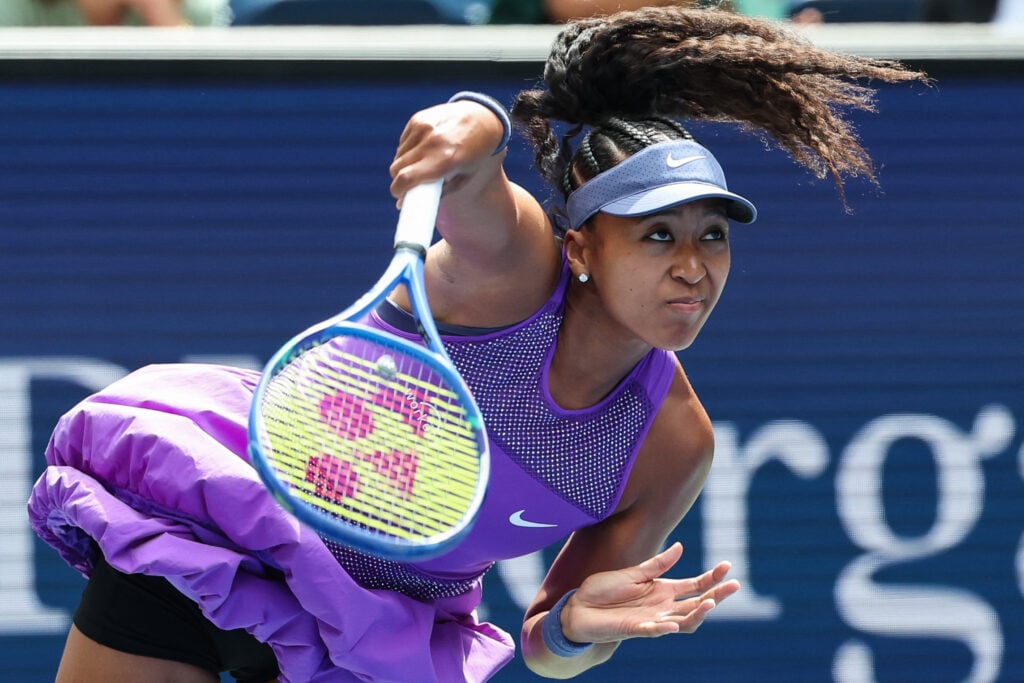 Naomi Osaka hits a serve at the 2025 US Open