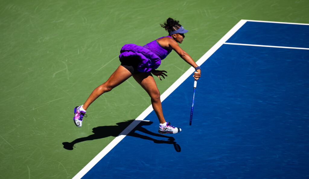 Naomi Osaka serves