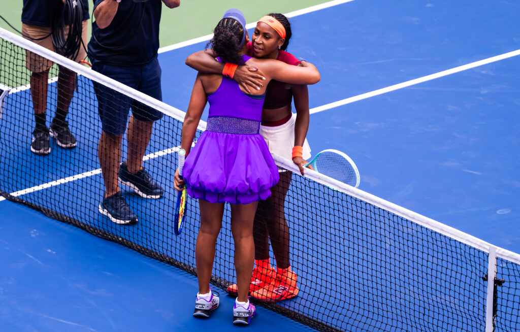 Coco Gauff and Naomi Osaka hug at the net