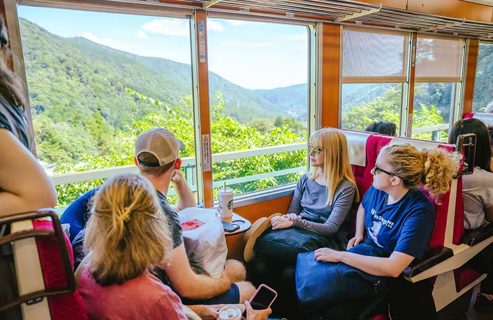 InsideJapan group travelling on local train in Hakone.