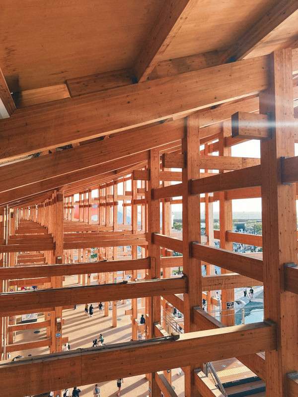 The close up of the wooden structure of the Grand Ring at Expo 2025