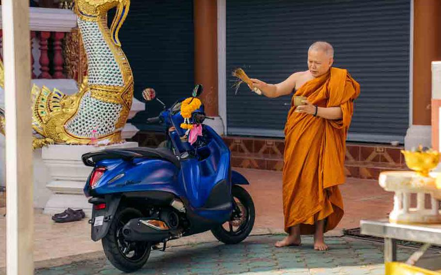 A monk blessing a scooter in Chiang Mai.