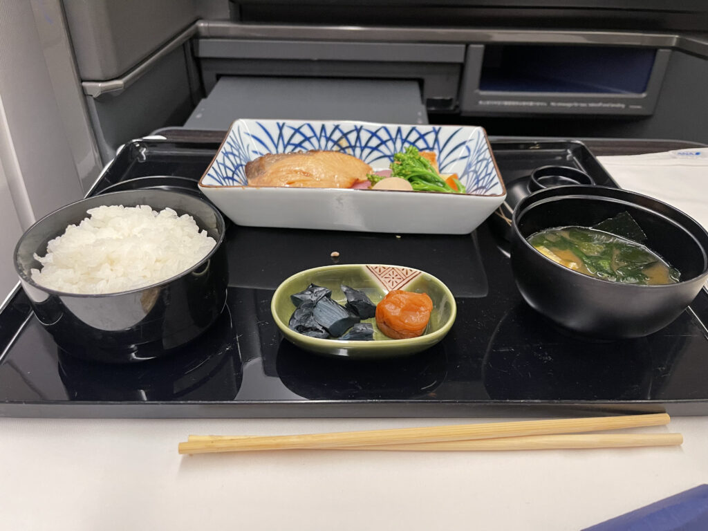 Teriyaki fish and miso soup served in-flight.