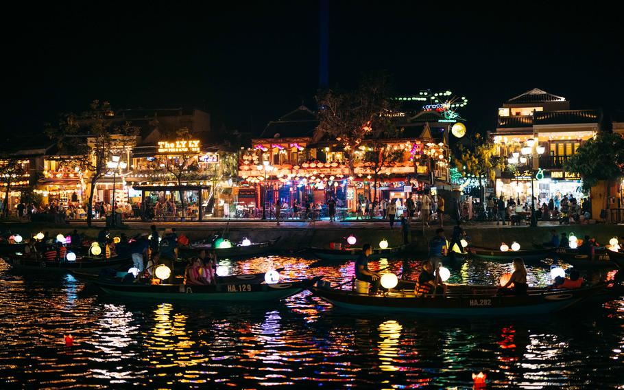 Hoi An at night. Some ships anchor in the river.