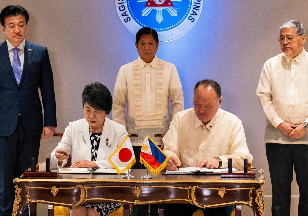 Japan’s Foreign Minister Yoko Kamikawa (left) and Philippine Defence Minister Gilberto Teodoro Jnr sign the Reciprocal Access Agreement on July 8, last year. Photo: AFP