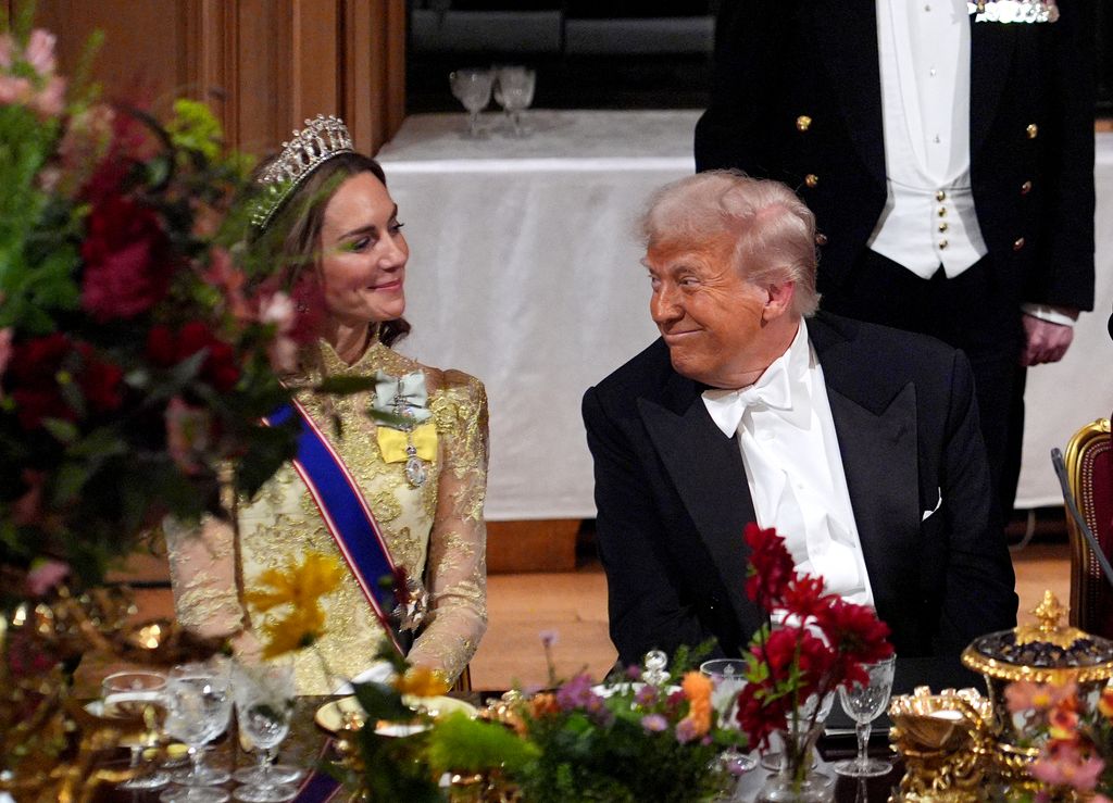 US President Donald Trump smiles at Britain's Catherine, Princess of Wales during a State Banquet at Windsor Castle