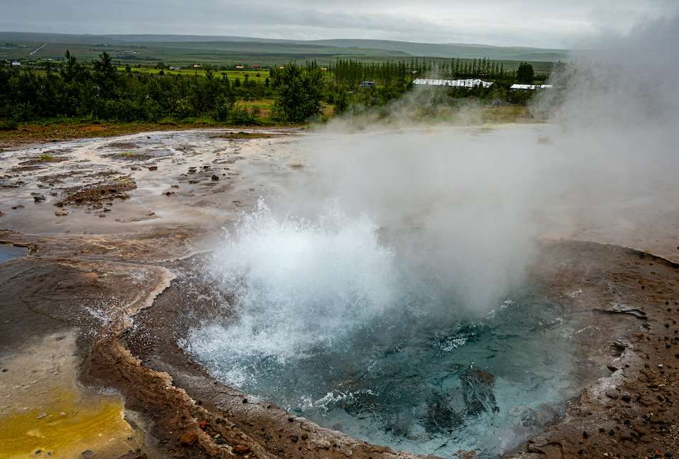 A hot spring in Iceland with steam