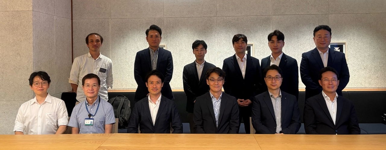K bank Chief Technology Officer Cha Dae-san (front, fourth from left), K bank’s digital asset task force lead Choi Jae-hyuk (back, fourth from left), as well as other officials of Project Pax, in Tokyo on Wednesday. (K bank)