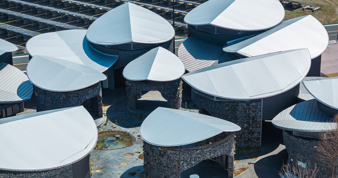 gabion walled-pavilion encircles biodiverse courtyard at osaka expo