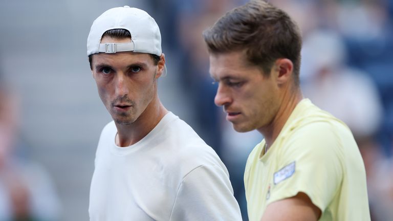 Neal Skupski of the United Kingdom (R) talks with partner Joe Salisbury of the United Kingdom against Yuki Bhambri of India and Michael Venu
