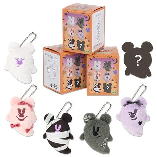 Five plush ghost keychains and three orange boxes from the 2025 Halloween Merchandise at Tokyo Disney Resort.
