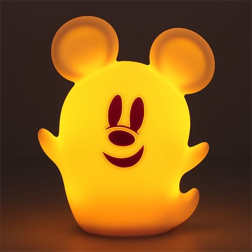 A glowing yellow ghost-shaped lamp with mouse ears, part of 2025 Halloween Merchandise at Tokyo Disney Resort.