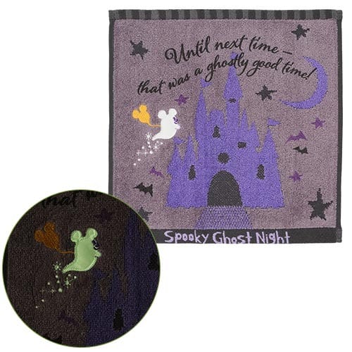 A purple hand towel from Tokyo Disney Resort’s 2025 Halloween merchandise, featuring ghosts, bats, and a haunted castle.