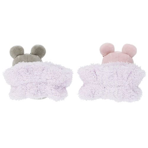 Two plush toys with bear ears, part of Tokyo Disney Resort 2025 Halloween Merchandise, snuggled under lavender blankets.