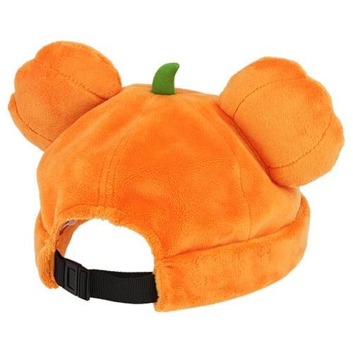 Plush orange hat shaped like a pumpkin with round ears, green stem, and adjustable strap—2025 Halloween Merchandise at Tokyo Disney Resort.