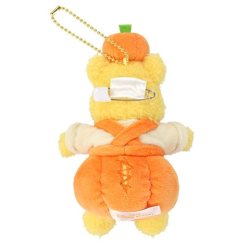 Plush bear keychain in orange overalls from Tokyo Disney Resort’s 2025 Halloween merchandise, safety pin on back.