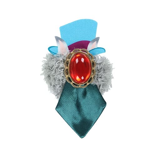 A decorative brooch from Tokyo Disney Resort's 2025 Halloween merchandise, with a red gem, teal ribbon, and blue felt accents.