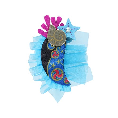 Whimsical blue and black brooch with star, shell, and swirl patterns—part of 2025 Halloween Merchandise at Tokyo Disney Resort.