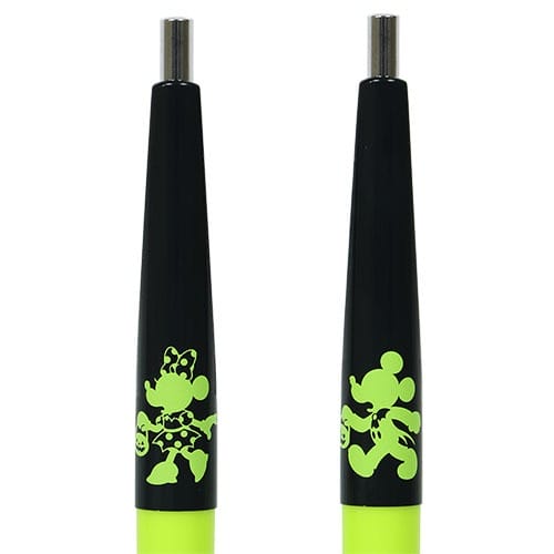 Two black and neon yellow pens from Tokyo Disney Resort merchandise, featuring green cartoon mice outlines.