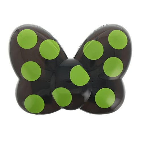 A black butterfly-shaped object with large green polka dots, part of 2025 Halloween Merchandise at Tokyo Disney Resort.
