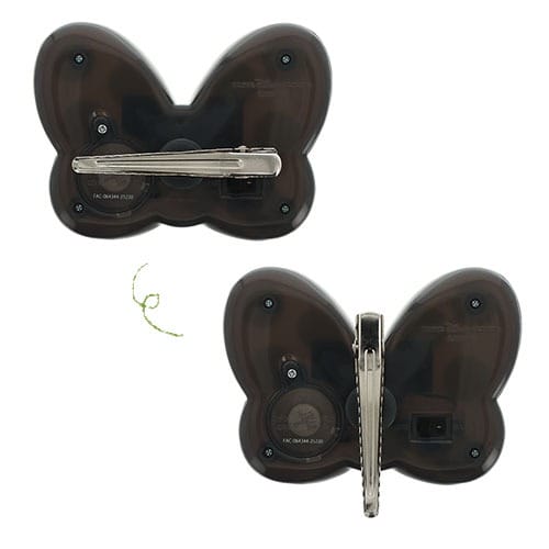 Two black butterfly-shaped devices, inspired by 2025 Halloween Merchandise, each with a metal clip and screws on the back.