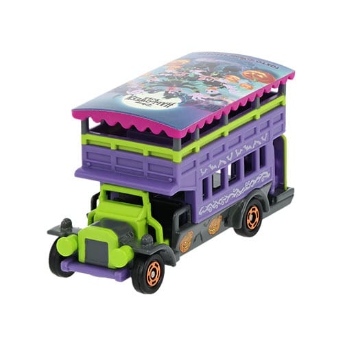 A 2025 Tokyo Disney Resort Halloween merchandise toy bus in purple, green, and black with festive cartoon roof designs.