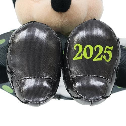Close-up of a plush toy’s feet, featuring "2025" in green—part of Tokyo Disney Resort's Halloween Merchandise.