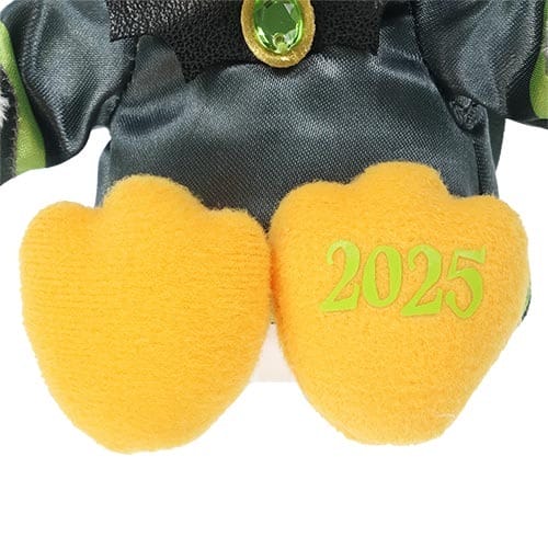Close-up of 2025 Halloween Merchandise at Tokyo Disney Resort—plush toy’s yellow feet, one sole embroidered with "2025".