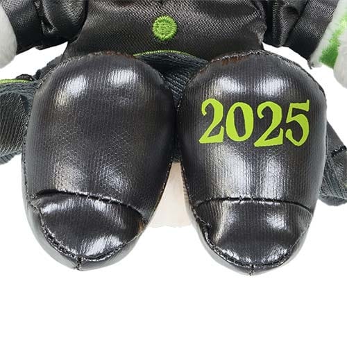Close-up of a plush toy's black feet, with "2025" printed in green, from Tokyo Disney Resort's Halloween Merchandise.