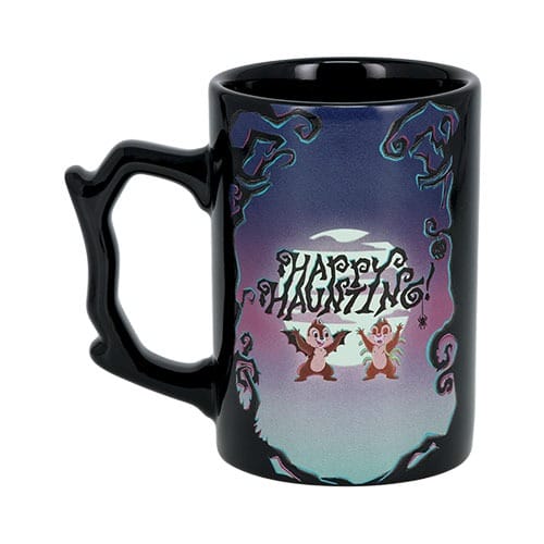 Black mug with a "Happy Haunting" design, part of the 2025 Tokyo Disney Resort Halloween merchandise collection.