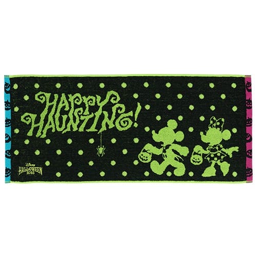 Black towel from Tokyo Disney Resort's 2025 Halloween Merchandise with "Happy Haunting!" text, spiders, and pumpkins.