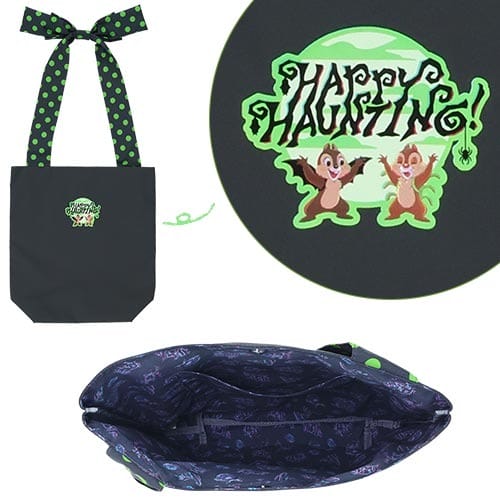 Black tote bag with green polka dot handles, "Happy Haunting!" text, and chipmunks; 2025 Halloween Tokyo Disney Resort merch.