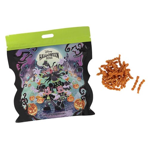 A 2025 Tokyo Disney Resort Halloween merchandise snack bag with Mickey, Minnie, and festive orange treats beside it.