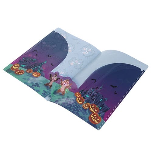 Open notebook featuring 2025 Tokyo Disney Resort Halloween merchandise with pumpkins, bats, and cartoon characters.