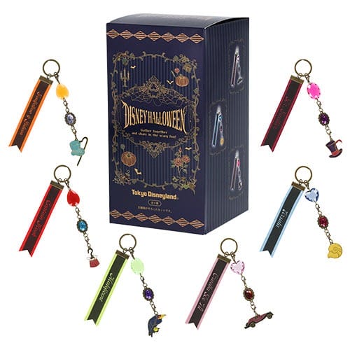 Box labeled "Disney Halloween" with seven colorful Tokyo Disney Resort 2025 Halloween merchandise keychains displayed.