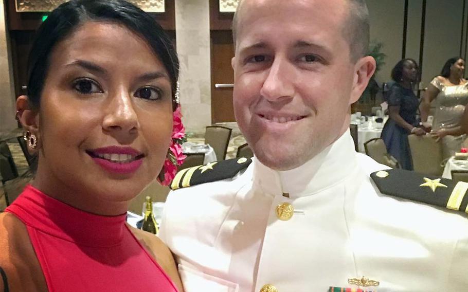A man and a woman pose for a photo.