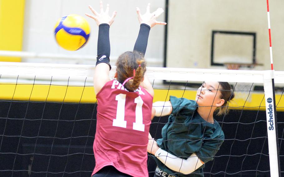 Yuri Biggins spikes the ball.