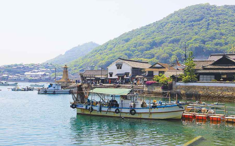 Vessels anchor at the wharf in the harbor of Tomonoura.