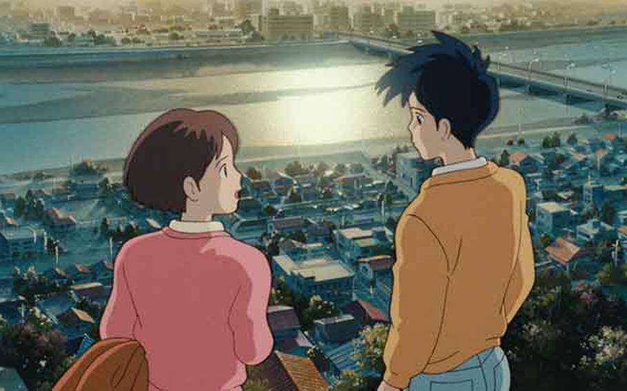 Two people chat on the hill.