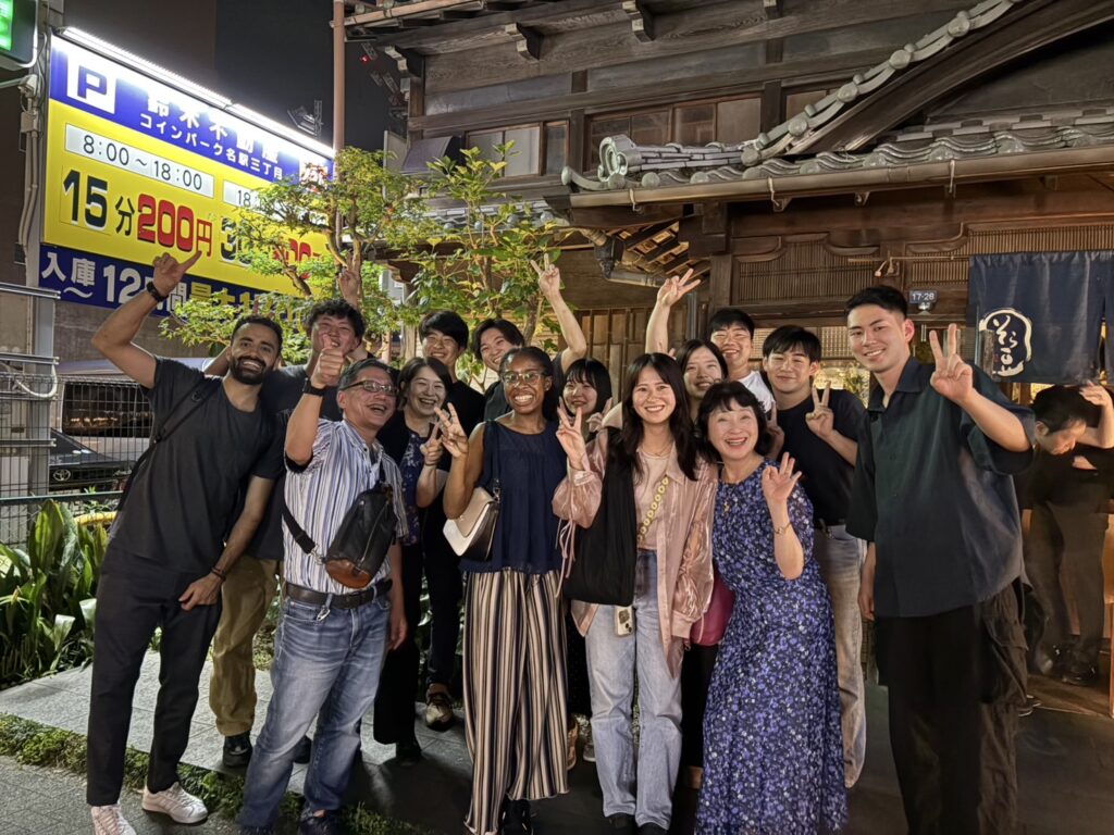 Group of people standing in front of restaurant
