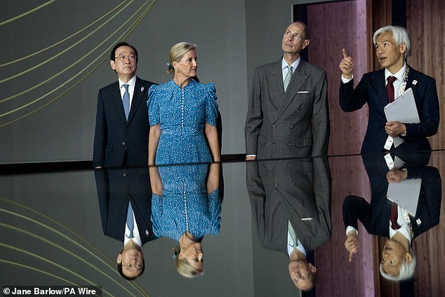 The Duke and Duchess of Edinburgh, with Commissioner General Mr Haneda (left) and Pavilion Director Noriyuki Kuroda (right) in the Japan Pavilion