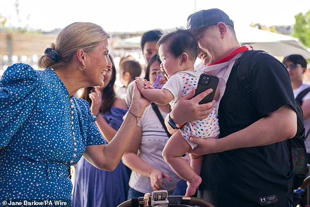 Elsewhere, the mother-of-two was also snapped greeting young babies and parents as she met members of the public at the expo