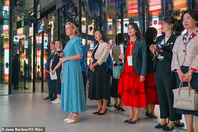 The Duchess of Edinburgh looks at an interactive display at the Women's Pavilion on Monday