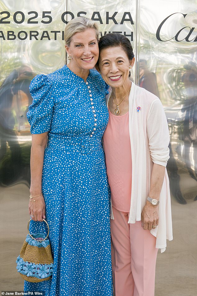 Princess Takamado - the wife of the late Prince Norihito of Takamado - beamed as she posed outside the building with the British royal for photographers
